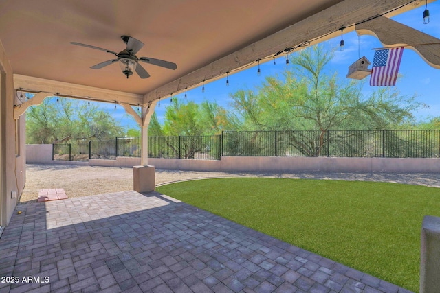1336 E Belmont Ave, Phoenix, AZ 85020 - fenced backyard with ceiling fan and a patio area