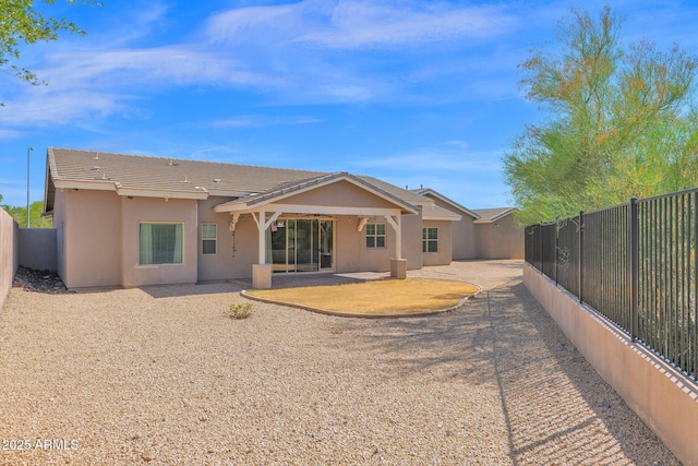1336 E Belmont Ave, Phoenix, AZ 85020 - back of house with a fenced backyard, stucco siding, a patio, and a tile roof