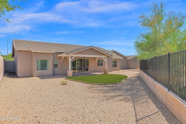 1336 E Belmont Ave, Phoenix, AZ 85020 - back of house with a fenced backyard, stucco siding, a patio area, and a tile roof
