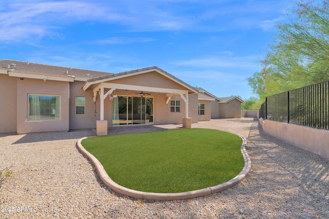 1336 E Belmont Ave, Phoenix, AZ 85020 - back of house featuring ceiling fan, stucco siding, a patio, and a fenced backyard