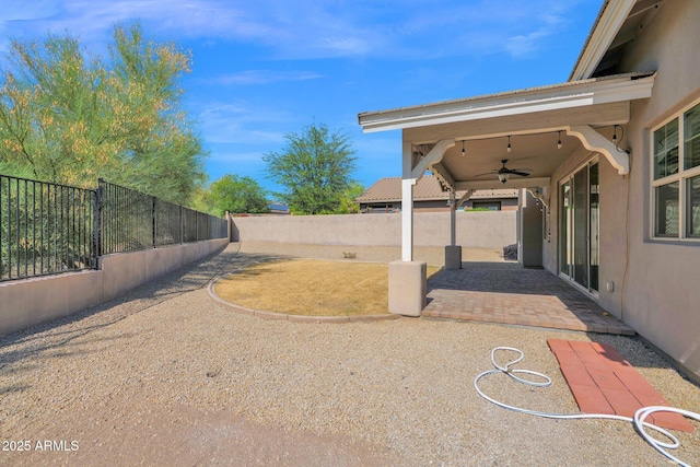 1336 E Belmont Ave, Phoenix, AZ 85020 - fenced backyard with a ceiling fan and a patio area