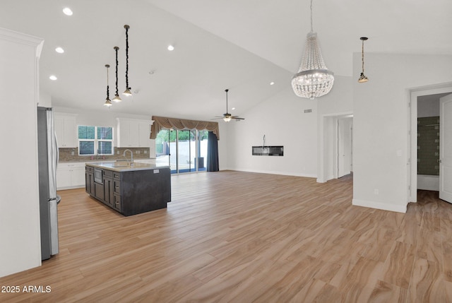 1336 E Belmont Ave, Phoenix, AZ 85020 - kitchen featuring freestanding refrigerator, white cabinets, open floor plan, recessed lighting, and ceiling fan