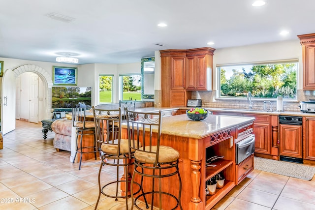 7155 E Oakmont Dr, Paradise Valley, AZ 85253 - kitchen featuring a wealth of natural light, a sink, a warming drawer, and backsplash