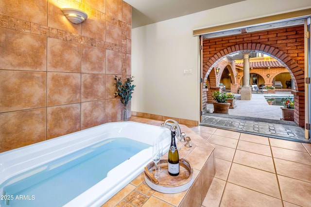 7155 E Oakmont Dr, Paradise Valley, AZ 85253 - full bath with ornate columns, a garden tub, and tile patterned floors