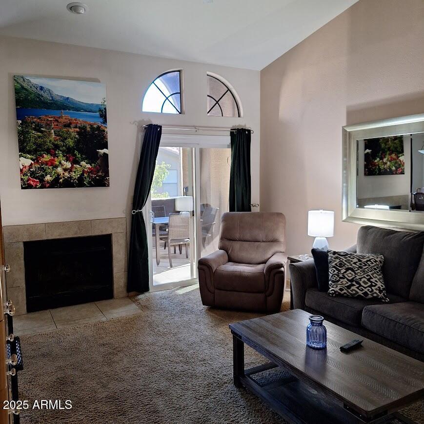 tiled living room with a fireplace