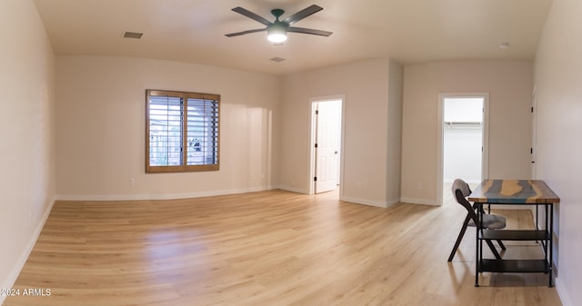 unfurnished room featuring light hardwood / wood-style flooring and ceiling fan