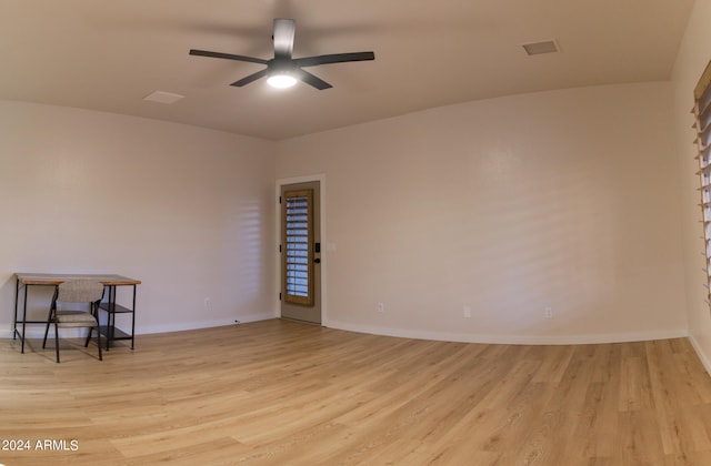 empty room featuring light hardwood / wood-style floors and ceiling fan