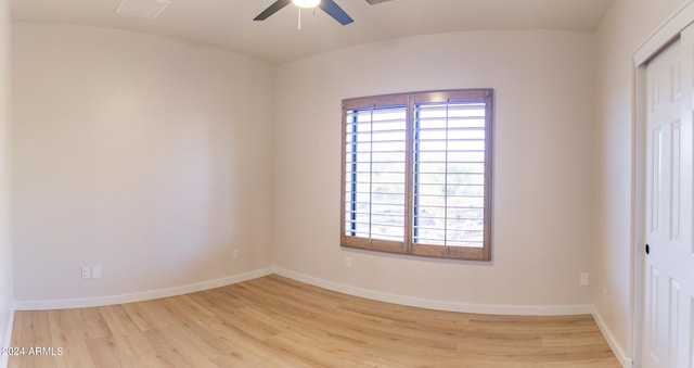 empty room with ceiling fan and light wood-type flooring