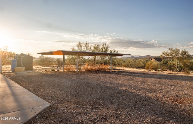 view of yard with a mountain view and a carport