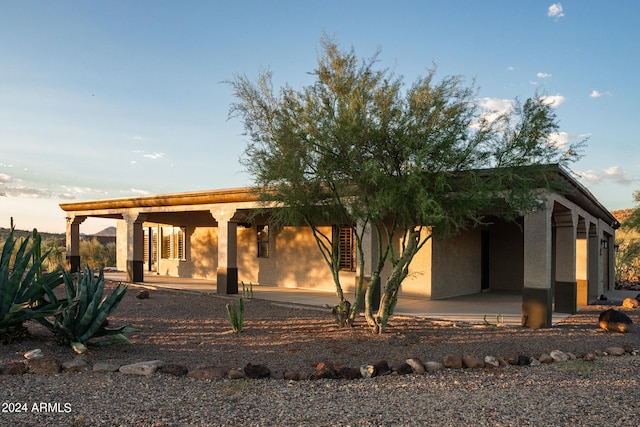 rear view of property featuring a patio