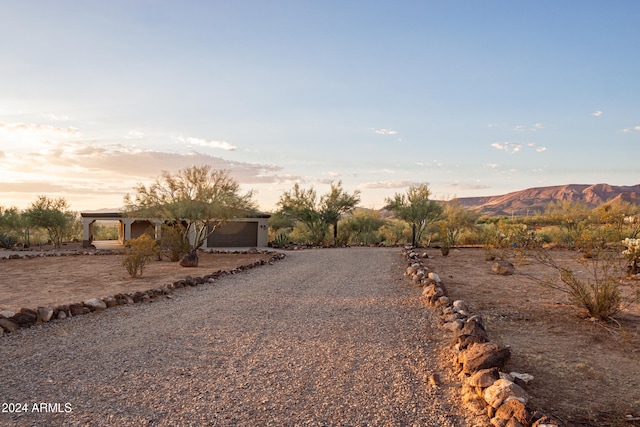 view of front of property featuring a garage and a mountain view