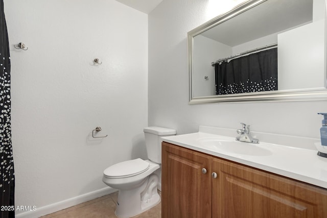 bathroom with toilet, tile patterned flooring, and vanity