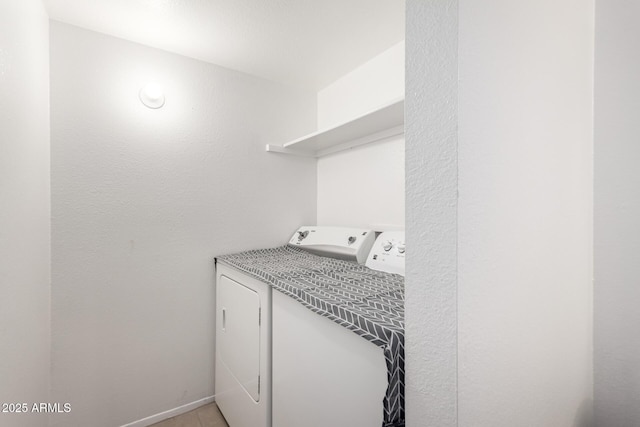 washroom featuring independent washer and dryer and light tile patterned floors