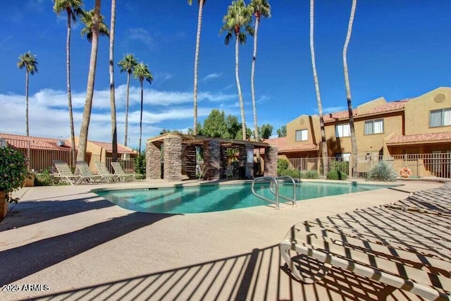 view of swimming pool with a patio area