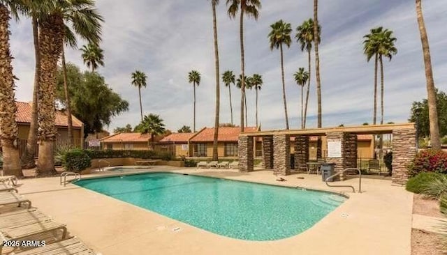 view of swimming pool with a patio