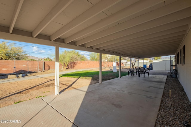 view of patio / terrace with a shed