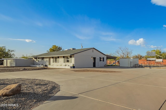 view of front of property with a carport