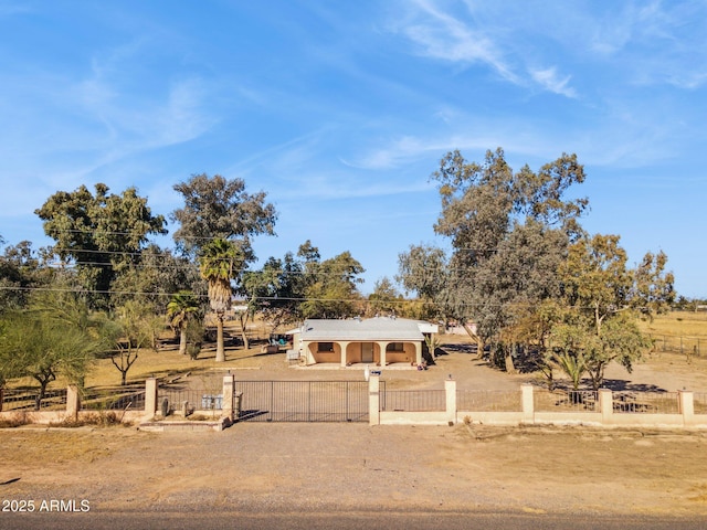 view of front of home with a rural view