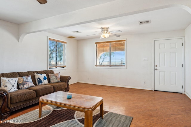 living room featuring light hardwood / wood-style floors and ceiling fan