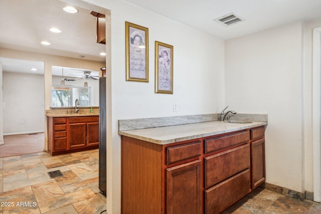 kitchen with ceiling fan and sink