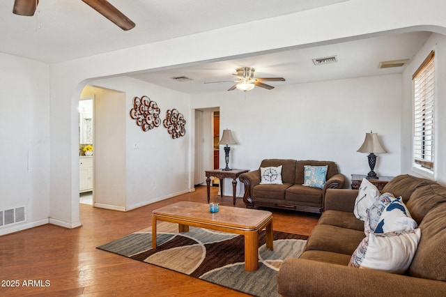 living room with hardwood / wood-style flooring and ceiling fan