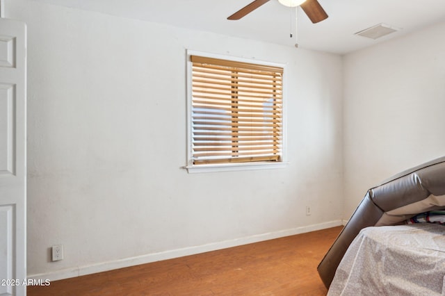 bedroom with hardwood / wood-style flooring