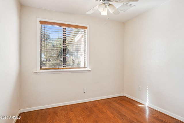 unfurnished room featuring hardwood / wood-style flooring and ceiling fan