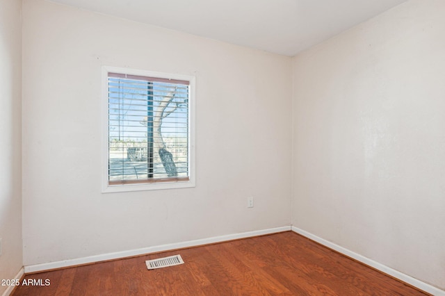 unfurnished room featuring hardwood / wood-style flooring