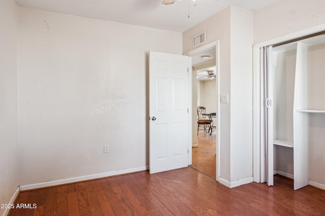 unfurnished bedroom with hardwood / wood-style floors