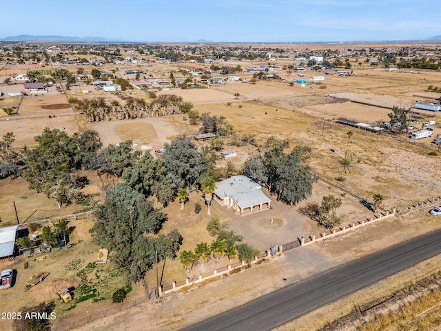 birds eye view of property with a rural view