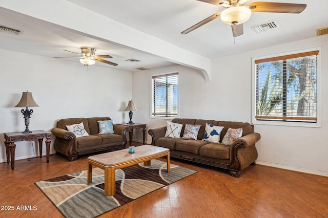 living room with wood-type flooring and ceiling fan