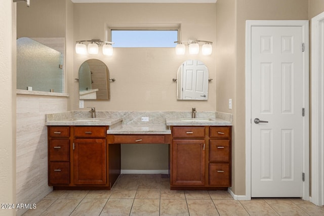 bathroom featuring tile patterned flooring and vanity