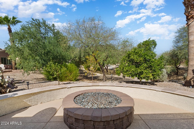 view of patio / terrace with an outdoor fire pit