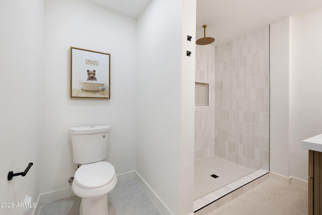 2808 N Steves Blvd, Flagstaff, AZ 86004 - bathroom featuring toilet, tiled shower, vanity, and baseboards
