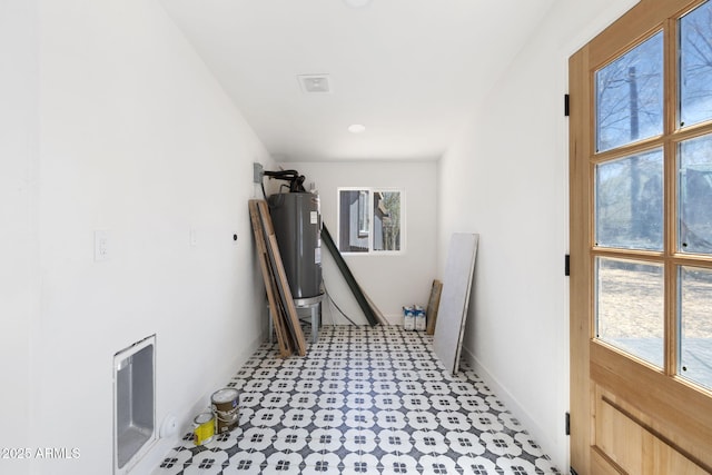2808 N Steves Blvd, Flagstaff, AZ 86004 - laundry room featuring visible vents, a healthy amount of sunlight, electric water heater, and light floors