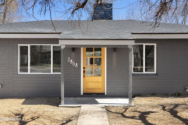 2808 N Steves Blvd, Flagstaff, AZ 86004 - entrance to property featuring concrete block siding and roof with shingles