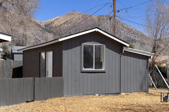 2808 N Steves Blvd, Flagstaff, AZ 86004 - view of side of property featuring a mountain view, fence, and an outdoor structure