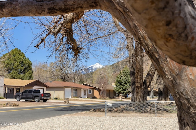 2808 N Steves Blvd, Flagstaff, AZ 86004 - view of front facade featuring fence and a garage