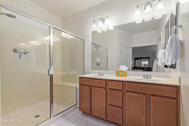 bathroom with vanity and a shower with shower door