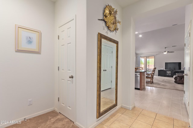 hallway with light colored carpet