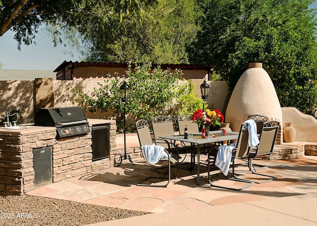 view of patio featuring grilling area and an outdoor kitchen