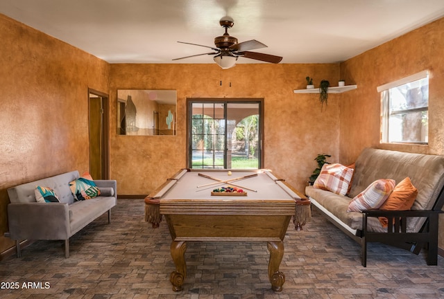 game room with ceiling fan and pool table