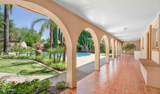 view of swimming pool featuring a patio