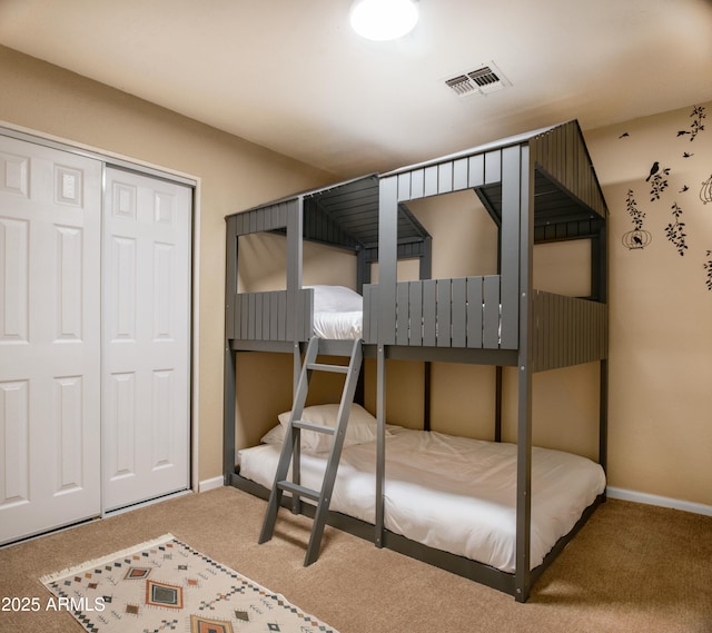 bedroom featuring carpet and a closet