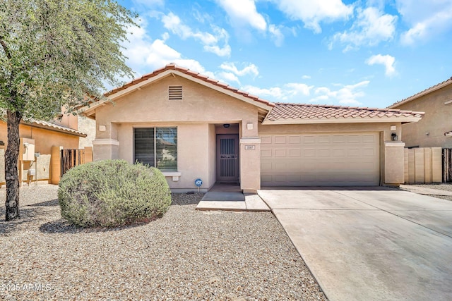 597 S 167th Dr, Goodyear, AZ 85338 - view of front facade featuring stucco siding, an attached garage, concrete driveway, and a tiled roof