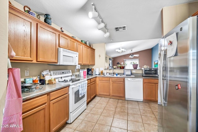 597 S 167th Dr, Goodyear, AZ 85338 - kitchen featuring white appliances, light tile patterned flooring, vaulted ceiling, a ceiling fan, and light countertops
