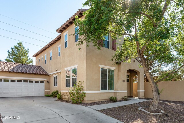 mediterranean / spanish-style house featuring a garage