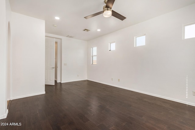 unfurnished room featuring ceiling fan and dark hardwood / wood-style flooring