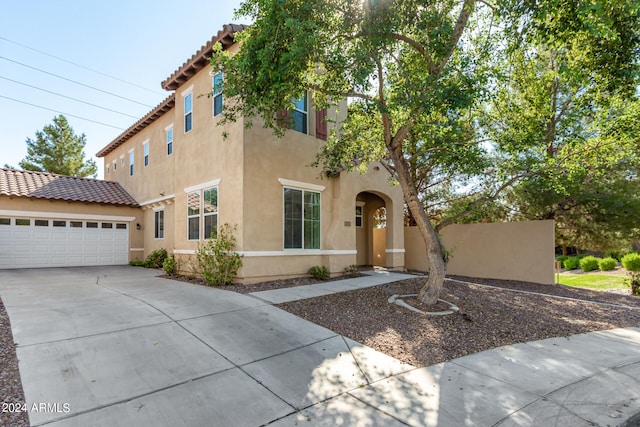 mediterranean / spanish-style house featuring a garage