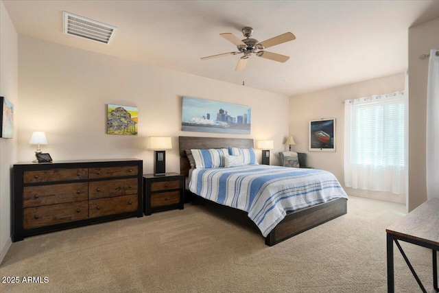 bedroom with light carpet, ceiling fan, and visible vents